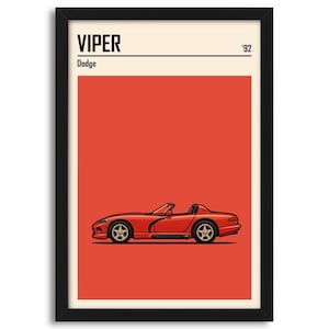 Puede incluir: Impresión artística enmarcada que presenta un descapotable Dodge Viper rojo. La obra de arte tiene un diseño minimalista con la palabra "VIPER" y "'92" en la parte superior. El coche está sobre un fondo rojo, con un borde crema.