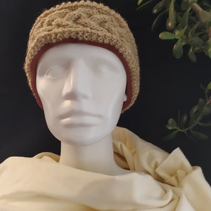 Hand-knitted headband with sewn-in jersey fabric