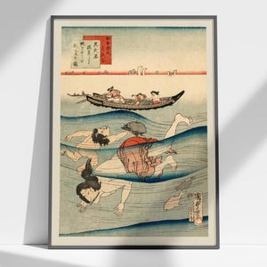 May include: Framed Japanese woodblock print depicting people swimming in blue water, with a boat in the background. The artwork features figures in the water and a boat with passengers. The print has Japanese text and a red and white color scheme.