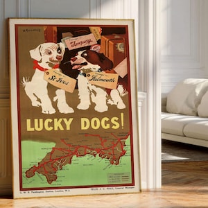 May include: A vintage-style travel poster titled LUCKY DOGS! featuring a white dog and a brown and white dog with luggage tags labeled St Ives, Falmouth, and Torquay. Below the dogs is a map of Cornwall with red railway lines and text.