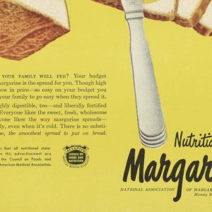 May include: A vintage advertisement for margarine, featuring a yellow background with a knife spreading margarine on bread. The text reads "Nutritious Margarine" and "National Association of Margarine Manufacturers".