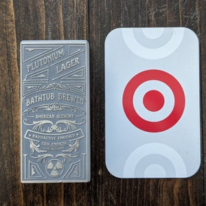Custom metal tap handle with credit card for size reference