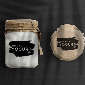 May include: Two brown paper wrapped yogurt jars with black brushstroke labels that say "MOCKUP YOGURT jar".