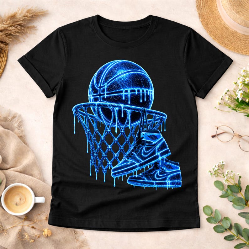 May include: A black short-sleeve t-shirt featuring a graphic print of a basketball, a basketball hoop, and a high-top sneaker. The design is rendered in a glowing neon blue color with a dripping liquid effect throughout the entire illustration.