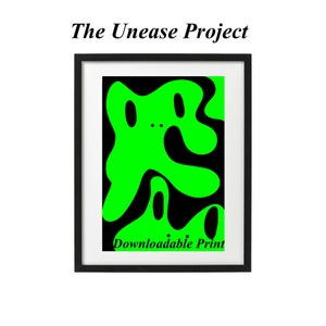 May include: A black framed print with a green abstract design. The design is a series of overlapping shapes that resemble a creature. The text "Downloadable Print" is at the bottom of the print.