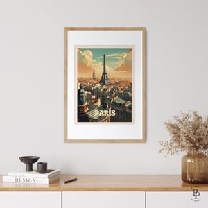 May include: A framed vintage travel poster featuring a view of the Eiffel Tower in Paris, France. The poster has a retro color palette and the text "PARIS" in a bold font.