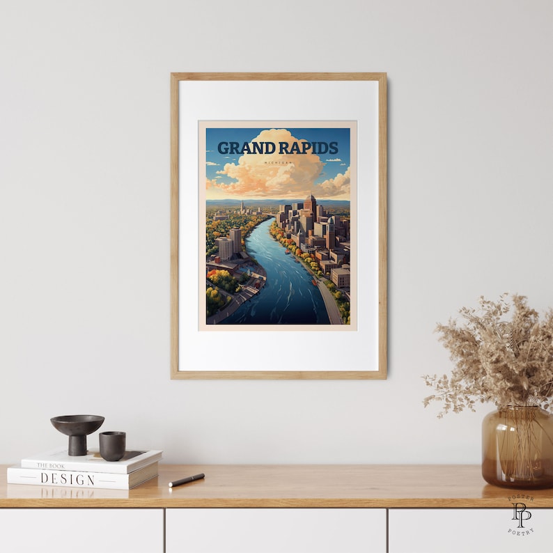 May include: A vintage-style travel poster featuring an aerial view of Grand Rapids, Michigan. The poster has a blue sky with white clouds and a river winding through the city. The text "GRAND RAPIDS" is in bold, blue letters at the top of the poster.