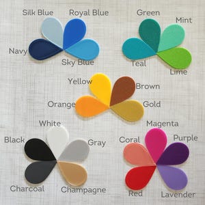 May include: A color chart with 20 different color swatches arranged in a flower shape. The colors include black, white, gray, red, orange, yellow, green, blue, purple, brown, pink, teal, mint, lime, gold, silver, navy, lavender, magenta, and champagne.