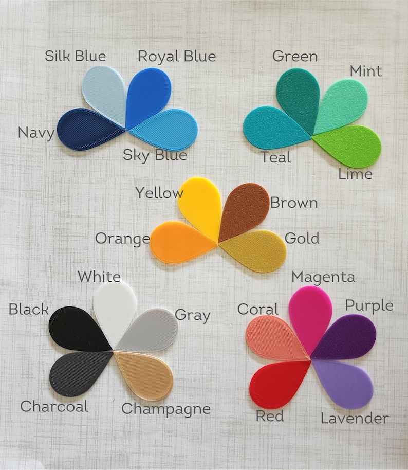 May include: A color chart with 20 different color swatches arranged in a flower shape. The colors include black, white, gray, red, orange, yellow, green, blue, purple, brown, pink, teal, mint, lime, gold, silver, navy, lavender, magenta, and champagne.