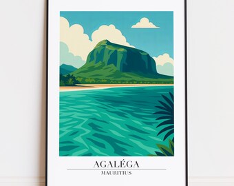 May include: A framed art print featuring a stylized landscape of Agaléga, Mauritius. The artwork depicts a green mountain, turquoise water, and a sandy beach under a blue sky with clouds. The text "AGALÉGA MAURITIUS" is at the bottom.