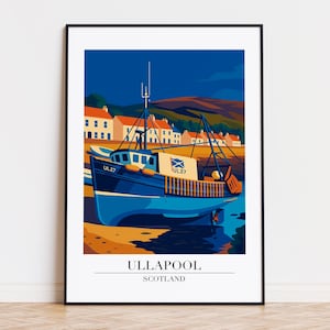 May include: A framed art print featuring a stylized illustration of a blue fishing boat in Ullapool, Scotland. The boat is docked near a shoreline with buildings and hills in the background. The print has a minimalist, graphic style.
