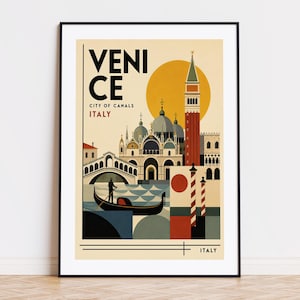 May include: A framed art print featuring a vintage travel poster of Venice, Italy. The poster has a stylized illustration of the city's landmarks, including a gondola, bridges, and the iconic St Mark's Campanile. Text reads "Venice, City of Canals, Italy."