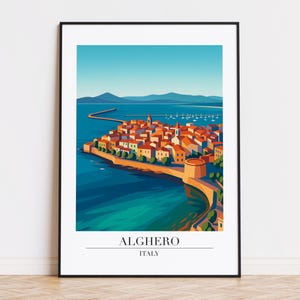May include: A framed art print featuring a stylized illustration of Alghero, Italy. The artwork depicts a coastal town with orange rooftops, a fortress, and a pier extending into the turquoise sea. The text "ALGHERO ITALY" is at the bottom.