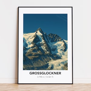 以下が含まれることがあります： 青い空の下、雪をかぶった山、グロースグロックナーを描いたフレーム入りプリント。プリントには「GROSSGLOCKNER 3.798 m | 12.461 ft」の文字があり、山の高さを表しています。
