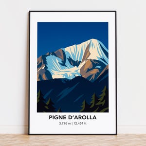 May include: A framed print of a mountain landscape. The artwork shows a snow-covered mountain under a dark blue sky, with the text "PIGNE D'AROLLA" and the elevation, 3,796 m, at the bottom.