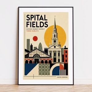 May include: A framed art print featuring a stylized graphic illustration of Spitalfields, London. The design includes the text SPITAL FIELDS, HISTORIC MARKET DISTRICT, TOWER HAMLETS, and UNITED KINGDOM, with a church spire, market building, and sun.