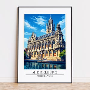 May include: A framed print featuring a detailed illustration of the Middelburg town hall in the Netherlands. The building is beige with red and white accents, set against a blue sky with clouds. The text "MIDDELBURG NETHERLANDS" is at the bottom.