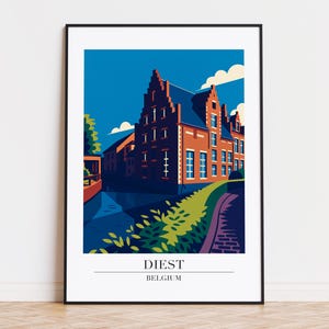 May include: A framed art print featuring a stylized illustration of a building in Diest, Belgium. The artwork uses a limited color palette of blue, orange, and green. The text "DIEST BELGIUM" is at the bottom of the print.