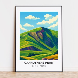 May include: A framed art print featuring a stylized illustration of Carruthers Peak. The artwork depicts a green mountain under a blue sky with fluffy clouds. The print includes the text "CARRUTHERS PEAK" and the measurements "2.145 m | 7.037 ft".