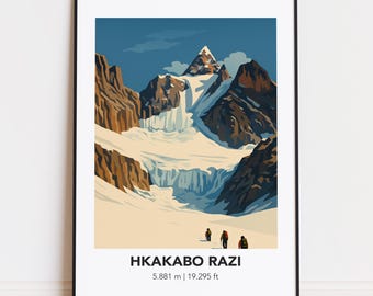 May include: A framed art print featuring a stylized illustration of a mountain landscape with the text "HKAKABO RAZI" and the elevation in meters and feet. The artwork depicts a snow-covered mountain with a blue sky and three figures at the base.