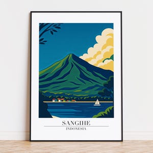 May include: A framed art print depicting a landscape of Sangihe, Indonesia. The image shows a green mountain, blue water, and a sailboat under a blue sky with yellow clouds. The text "Sangihe Indonesia" is at the bottom of the print.