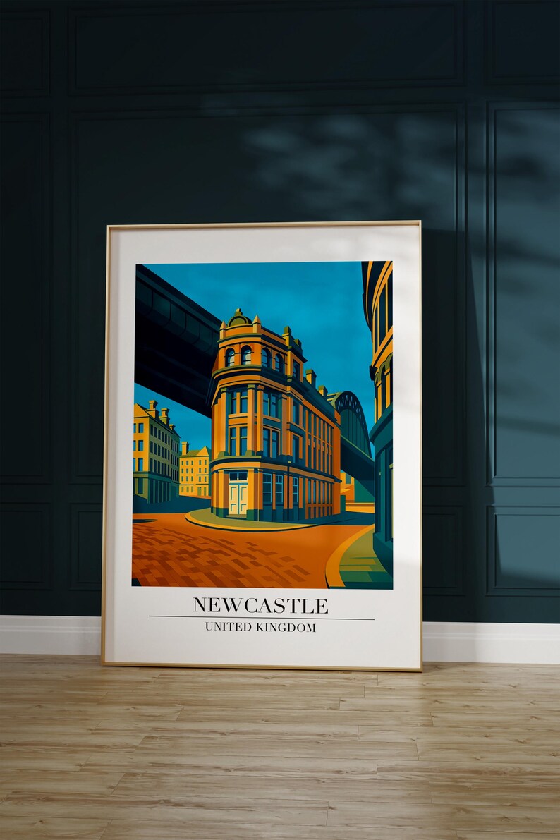 May include: A framed art print featuring a stylized illustration of a street scene in Newcastle, United Kingdom. The artwork showcases a building with orange and yellow tones under a blue sky. The print includes the text "NEWCASTLE UNITED KINGDOM".