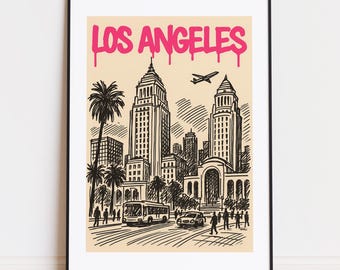 May include: Black framed art print featuring a Los Angeles cityscape illustration. The artwork includes palm trees, buildings, a bus, cars, and people. The words "LOS ANGELES" are written in pink graffiti-style font at the top.