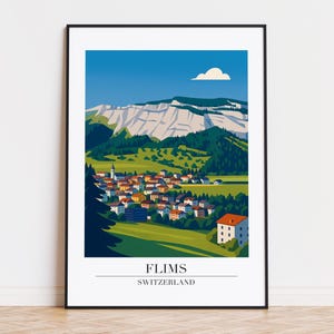 May include: A framed art print showing a colourful illustration of Flims, Switzerland. The artwork depicts a village in a valley with mountains and a blue sky. The text "FLIMS SWITZERLAND" is at the bottom of the print.