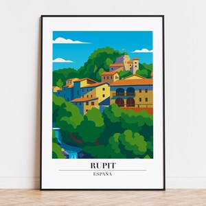 Peut inclure: Une affiche encadrée représentant une illustration colorée de Rupit, en Espagne. L'œuvre d'art montre des bâtiments aux toits orange, des arbres verts et un ciel bleu. Le texte "RUPIT ESPAÑA" est en bas.