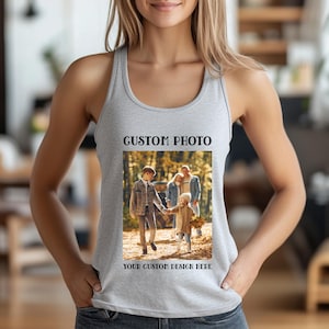 May include: A light gray tank top with a rectangular photo print. The print features a family walking in a forest, with the text "CUSTOM PHOTO" above and "YOUR CUSTOM DESIGN HERE" below the photo. The tank top is sleeveless.