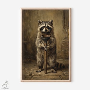 May include: A framed print depicting a raccoon holding a plunger. The raccoon has a black mask and brown fur, standing on a stone floor. The background is a muted, aged wall. The print has a vintage, whimsical aesthetic.