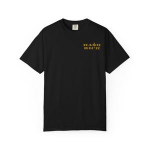 May include: Black t-shirt with the gold text "HASH RICH" printed on the front. The shirt has short sleeves and a crew neck. The text is in a bold, sans-serif font. The shirt is made of a soft material.
