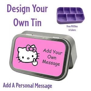 May include: A rectangular metal tin with a pink lid featuring a cartoon cat illustration and the text "Add Your Own Message." The image also includes a purple pill box and the text "Design Your Own Tin" and "Add A Personal Message."