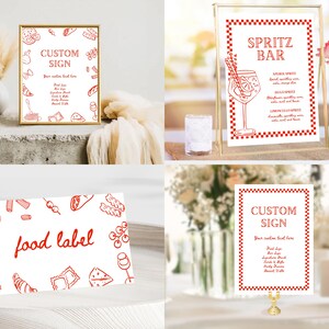 May include: A collection of red and white custom signs and food labels. The signs feature text and illustrations of food items and drinks. One sign reads "Spritz Bar" with a drawing of a cocktail. The signs are displayed in gold frames and on white surfaces.