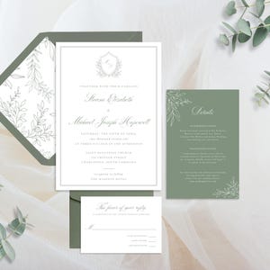 May include: Elegant wedding invitation suite featuring a main invitation, details card, and RSVP card. The design includes a white background with a gray border and text, and a green envelope with a floral pattern. Eucalyptus sprigs add a natural touch.