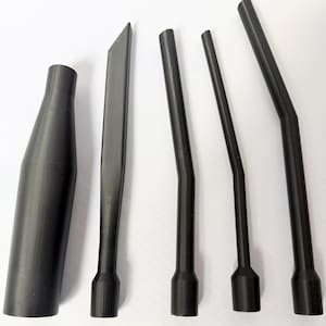 May include: A collection of black plastic tools, including a nozzle, a flat blade, and three angled rods. The tools have a matte finish and are arranged against a white background.