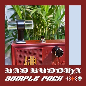 May include: A red and black guitar pedal with a clear acrylic handle, a black knob, and a gold Chinese character on the front. The pedal is labeled "Bad Buddha Sample Pack".