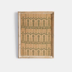 May include: A framed print featuring a repeating pattern of stylized green floral motifs on a tan background. The frame is a light, distressed wood. The artwork has a vintage, botanical aesthetic, suitable for home decor.