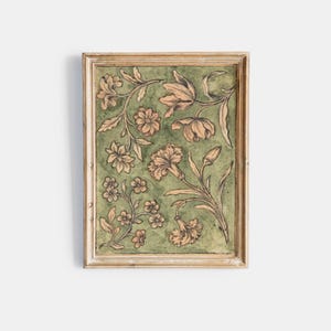 May include: A framed artwork featuring a floral design with delicate flowers and leaves in shades of brown and peach on a green background.