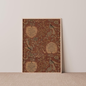 May include: A framed print of a vintage textile design featuring a repeating pattern of stylized flowers and birds in shades of brown, green, and yellow on a red background.