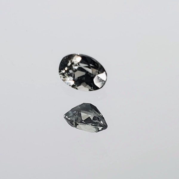 Montana sapphire light green-gray .41ct oval shape faceted rated SI2, slightly included untreated.