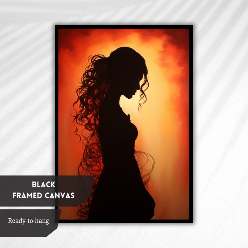 May include: A black and white silhouette of a woman with long, curly hair standing in front of a fiery orange and yellow background.