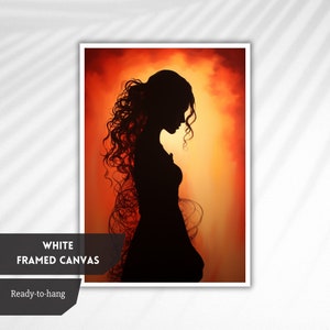 May include: A silhouette of a person with long, curly hair standing in front of a fiery orange and yellow background. The person is wearing a long dress and is looking down. The image is framed in white.