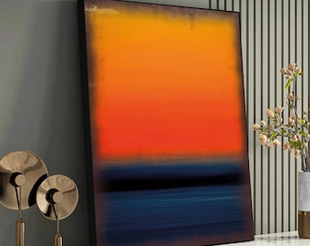 May include: Abstract art print with a black frame. The print features a gradient of orange and red colors at the top, transitioning to a dark blue at the bottom. The blue section has a horizontal black line in the middle.