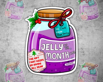 May include: A sticker featuring a jar of grape jelly with a wooden lid and a red ribbon. The label reads "Jelly of the Month Club" and "The gift that keeps on giving all year." A tag reads "To: Clark From: Frank Shirley."