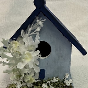 Decorative bird house in blue
