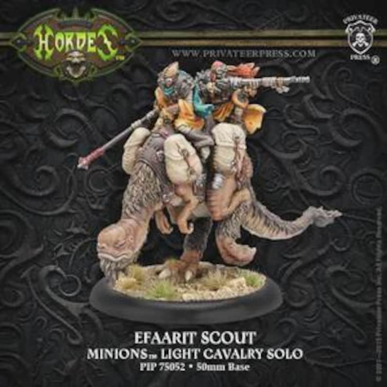 May include: A miniature figurine of an Efaarit Scout from the Hordes game, mounted on a creature. The figurine features detailed armor and weaponry, with a 50mm base. The color palette includes tan, brown, and green.