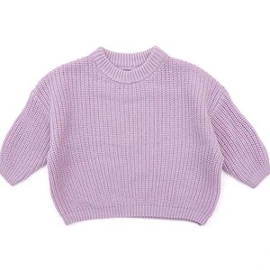May include: A lavender knitted sweater with a crew neck and long sleeves.