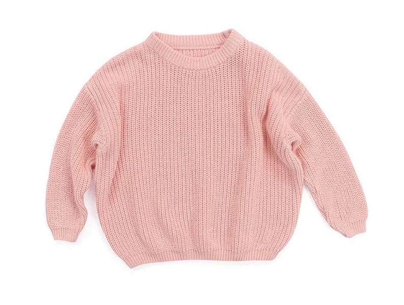 May include: A soft pink knitted sweater with a crew neck and long sleeves.