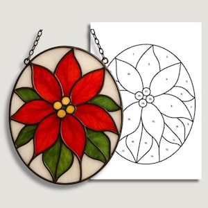 May include: Oval stained glass poinsettia with red petals, green leaves, and yellow centers. The design is framed in a black metal border and hangs from a chain. A matching pattern is next to it. The text "SGP STAINED GLASS PATTERNS" is at the top.